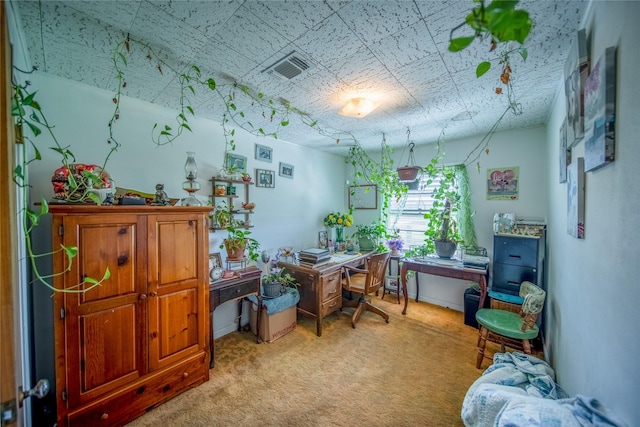 office space with visible vents and light colored carpet