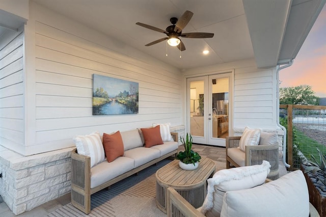 17703 Monarch Vista Ln, Conroe, TX 77302 - patio terrace at dusk with french doors, an outdoor living space, and ceiling fan