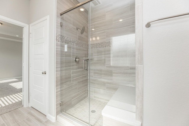 bathroom featuring a stall shower