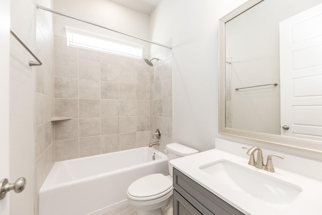 bathroom with vanity, washtub / shower combination, and toilet