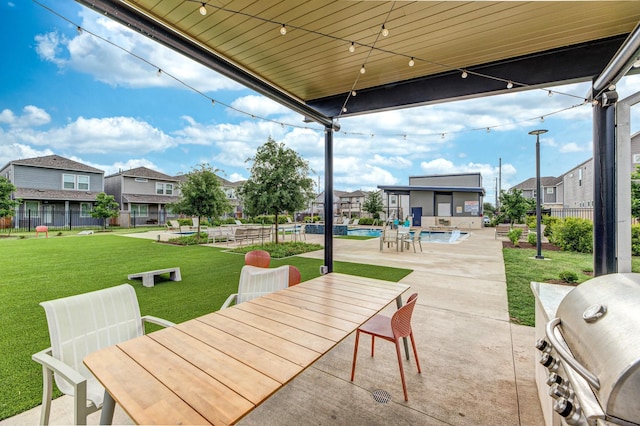 3011 Valley Peak Dr, Houston, TX 77063 - view of patio featuring a residential view, fence, a fenced in pool, and grilling area