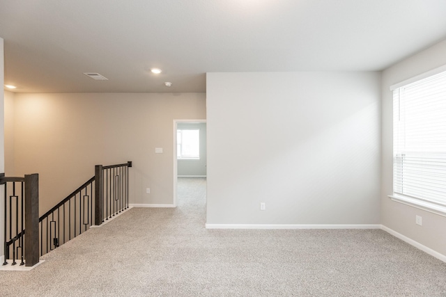 3011 Valley Peak Dr, Houston, TX 77063 - spare room featuring baseboards, visible vents, and carpet