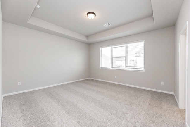 3011 Valley Peak Dr, Houston, TX 77063 - carpeted spare room with visible vents, baseboards, and a tray ceiling