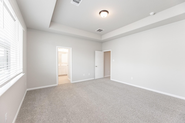 3011 Valley Peak Dr, Houston, TX 77063 - unfurnished bedroom with baseboards, visible vents, and light carpet