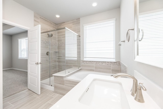 3011 Valley Peak Dr, Houston, TX 77063 - bathroom featuring a sink, a shower stall, recessed lighting, and a garden tub