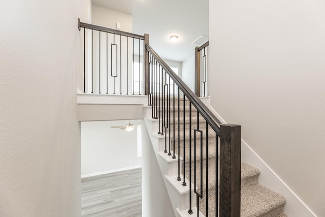 3011 Valley Peak Dr, Houston, TX 77063 - staircase featuring baseboards, a ceiling fan, and wood finished floors