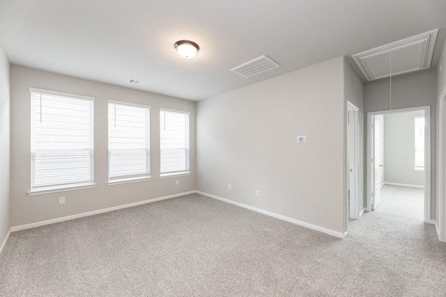 3011 Valley Peak Dr, Houston, TX 77063 - unfurnished room featuring visible vents, attic access, baseboards, and light colored carpet