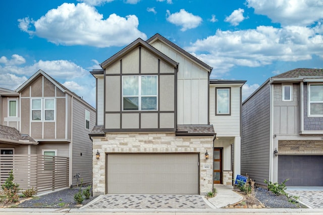 3011 Valley Peak Dr, Houston, TX 77063 - view of front facade featuring an attached garage, driveway, and stone siding