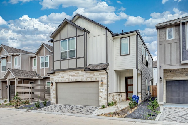 3011 Valley Peak Dr, Houston, TX 77063 - multi unit property featuring fence, stone siding, a garage, board and batten siding, and driveway