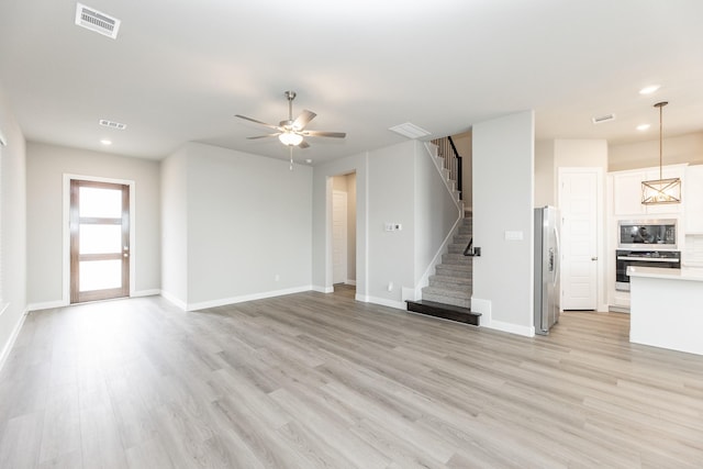 3011 Valley Peak Dr, Houston, TX 77063 - unfurnished living room featuring stairs, recessed lighting, ceiling fan, and visible vents