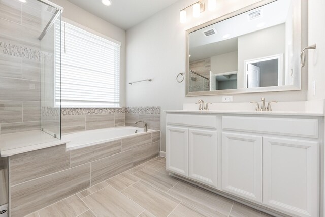 3011 Valley Peak Dr, Houston, TX 77063 - bathroom with visible vents, a sink, and a shower stall