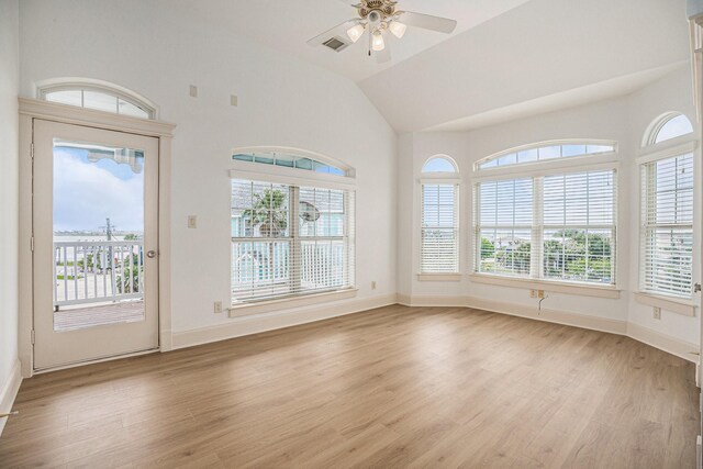 interior space with light wood-type flooring, ceiling fan, and a healthy amount of sunlight