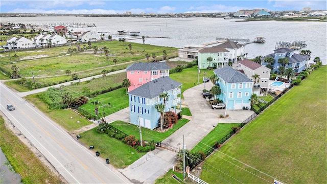 drone / aerial view with a water view and a residential view