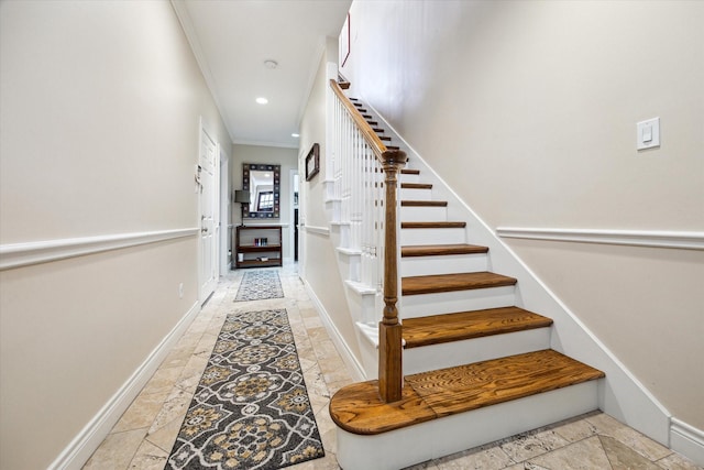 stairway featuring crown molding, baseboards, and recessed lighting