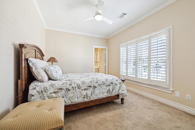 carpeted bedroom featuring visible vents, ornamental molding, baseboards, and a ceiling fan