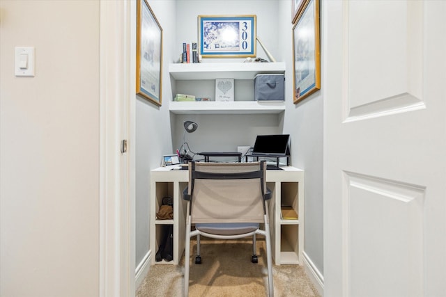 office space with baseboards and carpet