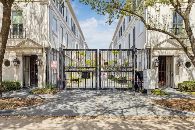 view of gate featuring fence