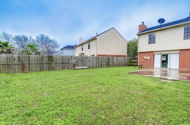 view of yard featuring a fenced backyard and a patio area