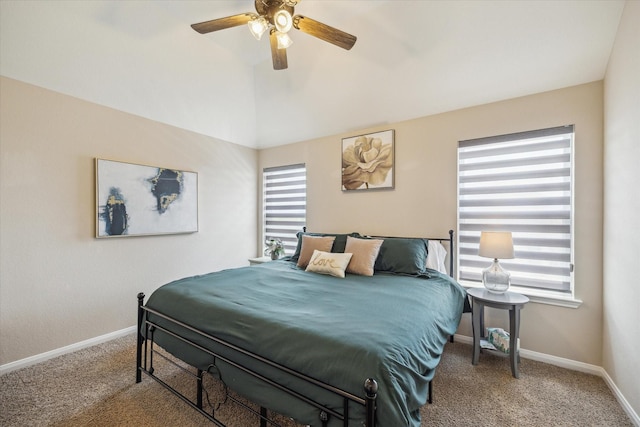 bedroom with carpet flooring, a ceiling fan, baseboards, and lofted ceiling