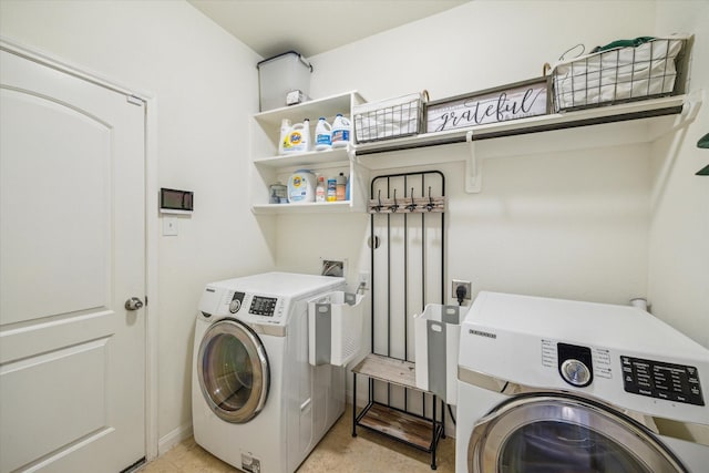 laundry room with laundry area and washing machine and clothes dryer
