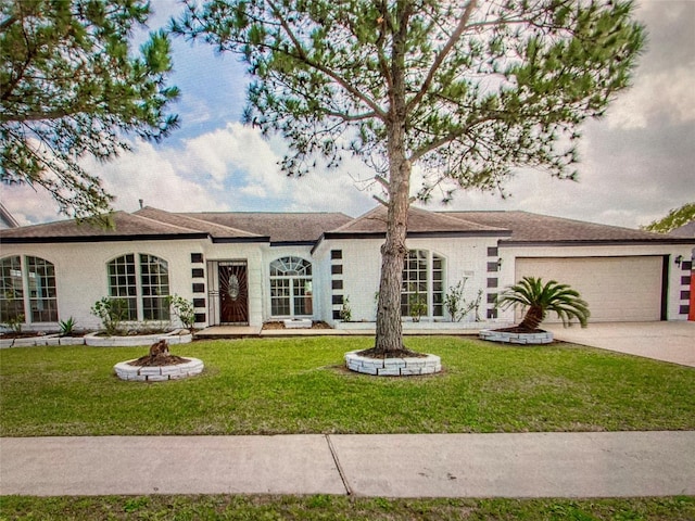ranch-style house with a garage, a front yard, and concrete driveway