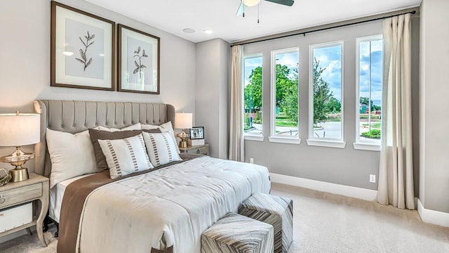 1408 River Point Dr, Friendswood, TX 77546 - bedroom with light colored carpet, baseboards, and ceiling fan