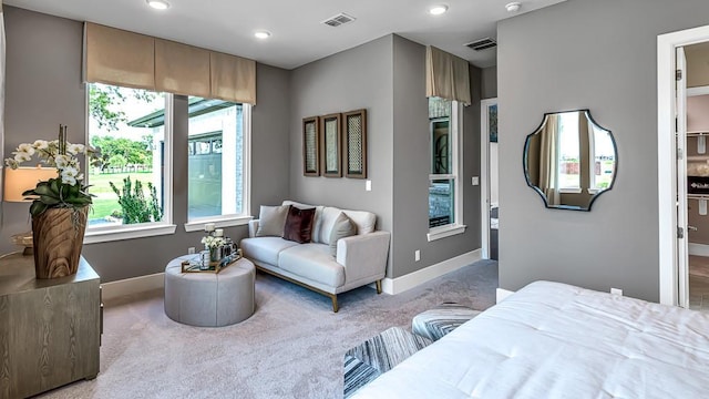 carpeted bedroom with baseboards, multiple windows, and visible vents