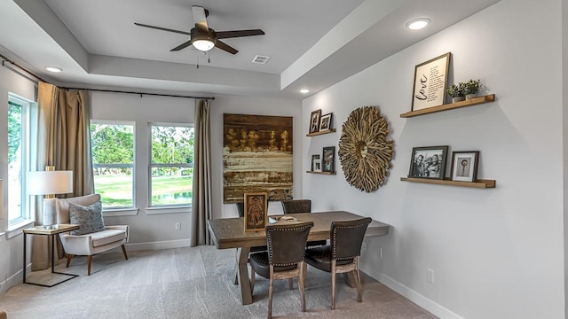 dining room with carpet floors, baseboards, and ceiling fan