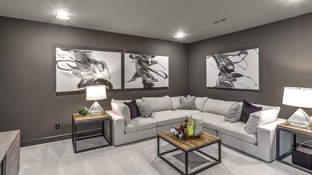 living area featuring recessed lighting, baseboards, and light colored carpet