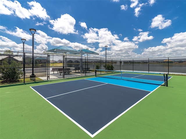 view of sport court with fence