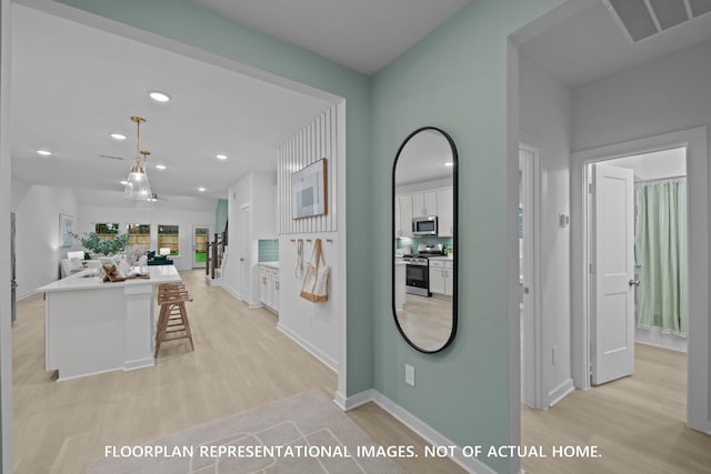 16205 Mcdonald County Ct, Montgomery, TX 77316 - corridor featuring light wood-type flooring, recessed lighting, and baseboards