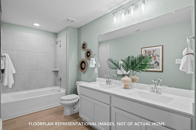 16205 Mcdonald County Ct, Montgomery, TX 77316 - bathroom featuring toilet, wood finished floors, double vanity, bathing tub / shower combination, and recessed lighting