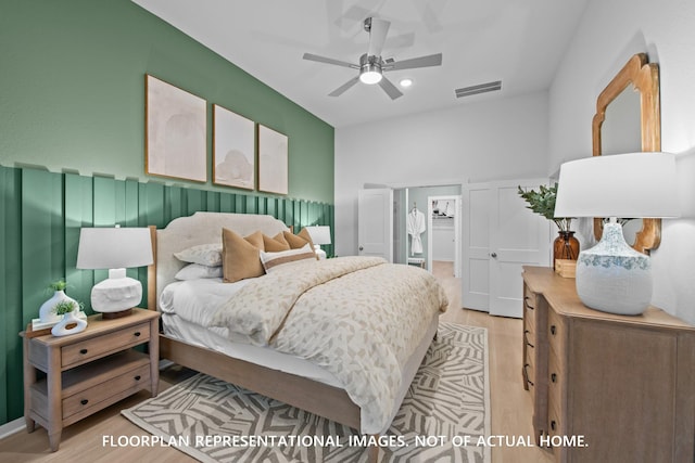 16205 Mcdonald County Ct, Montgomery, TX 77316 - bedroom featuring light wood-style floors, a spacious closet, ceiling fan, and recessed lighting