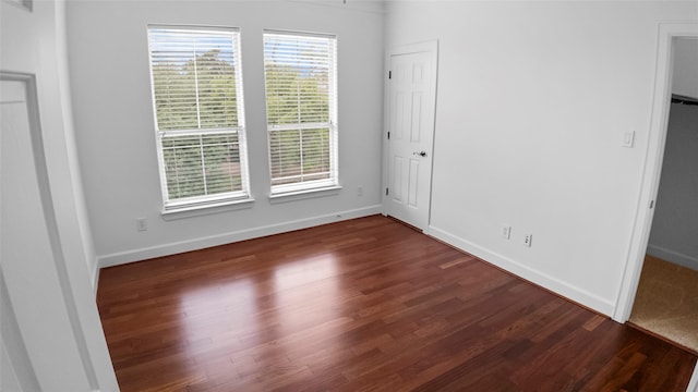 4524 Rose St, Houston, TX 77007 - unfurnished bedroom with baseboards and wood finished floors