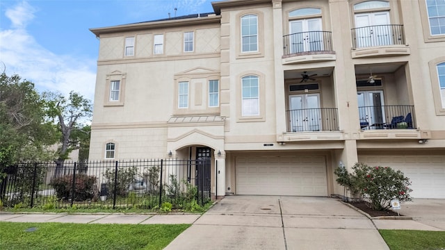 4524 Rose St, Houston, TX 77007 - townhome / multi-family property featuring an attached garage, french doors, stucco siding, and a balcony