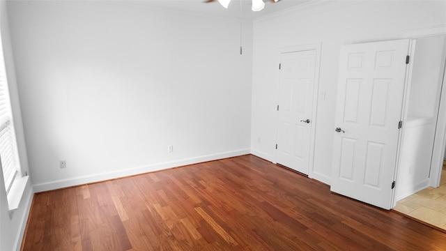 4524 Rose St, Houston, TX 77007 - empty room featuring crown molding, ceiling fan, baseboards, and wood finished floors