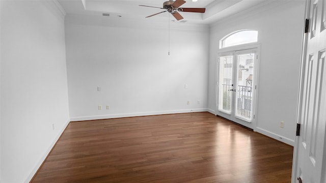 4524 Rose St, Houston, TX 77007 - empty room with ceiling fan, a wealth of natural light, a tray ceiling, and wood finished floors