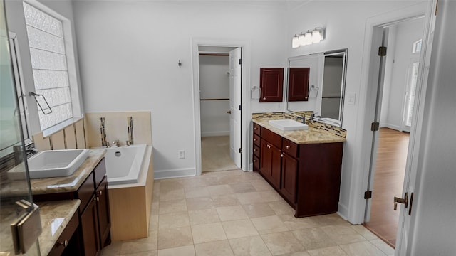 4524 Rose St, Houston, TX 77007 - full bath featuring baseboards, a sink, a bath, and two vanities