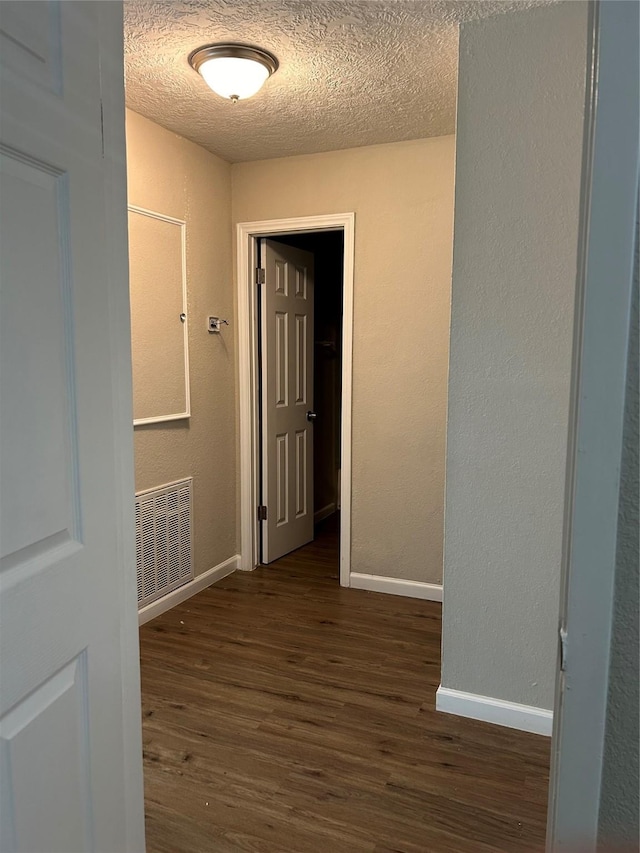 105 Will St, Willis, TX 77378 - hallway with visible vents, baseboards, and wood finished floors