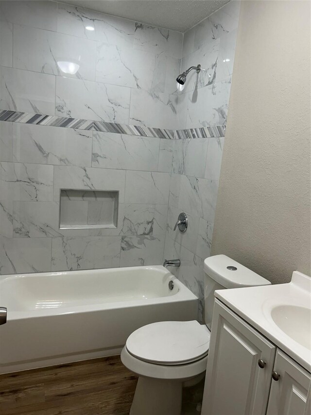 105 Will St, Willis, TX 77378 - full bathroom featuring vanity, toilet, wood finished floors, and tub / shower combination
