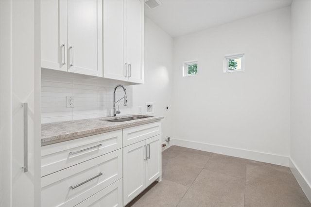 1550 Gardenia Dr, Houston, TX 77018 - laundry area with hookup for a washing machine, cabinet space, hookup for an electric dryer, baseboards, and hookup for a gas dryer