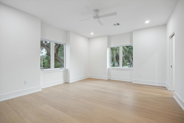 1550 Gardenia Dr, Houston, TX 77018 - unfurnished room featuring light wood-style floors, healthy amount of natural light, a ceiling fan, and recessed lighting