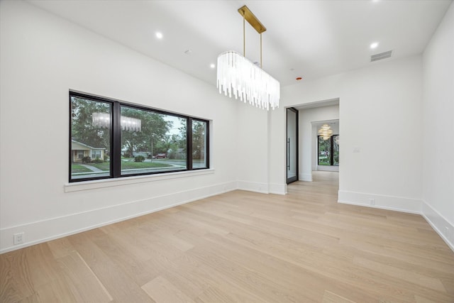 1550 Gardenia Dr, Houston, TX 77018 - spare room with light wood finished floors, recessed lighting, baseboards, and a chandelier