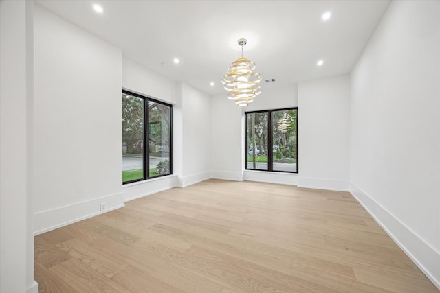 1550 Gardenia Dr, Houston, TX 77018 - spare room with light wood-style floors, a chandelier, recessed lighting, and baseboards