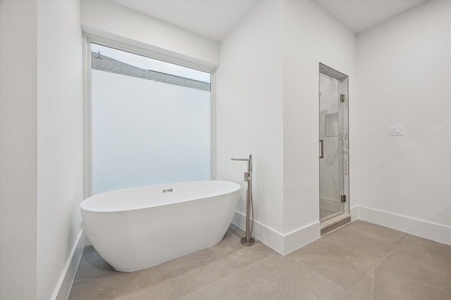 1550 Gardenia Dr, Houston, TX 77018 - full bathroom featuring a freestanding tub, a stall shower, and baseboards