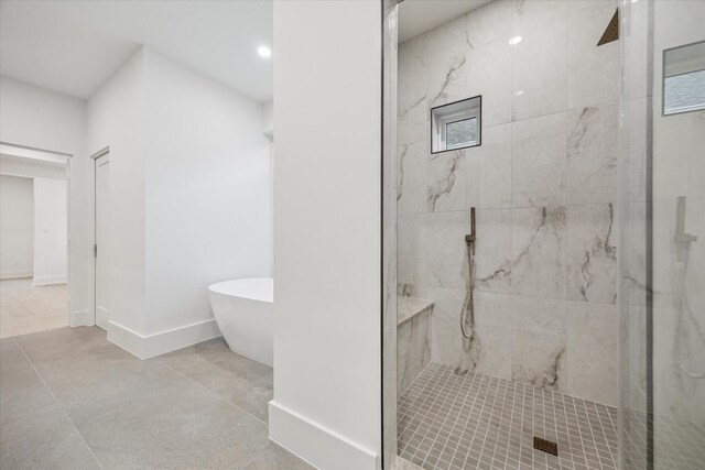 1550 Gardenia Dr, Houston, TX 77018 - bathroom with a marble finish shower, a soaking tub, baseboards, and recessed lighting