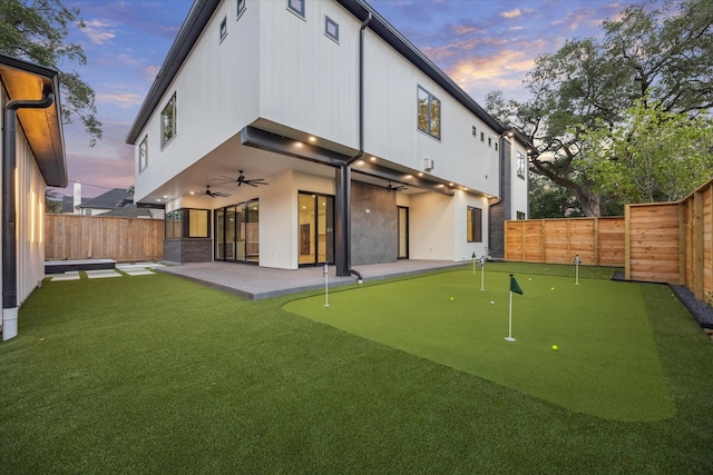 1550 Gardenia Dr, Houston, TX 77018 - back of house featuring a putting green, a ceiling fan, a patio, and a fenced backyard