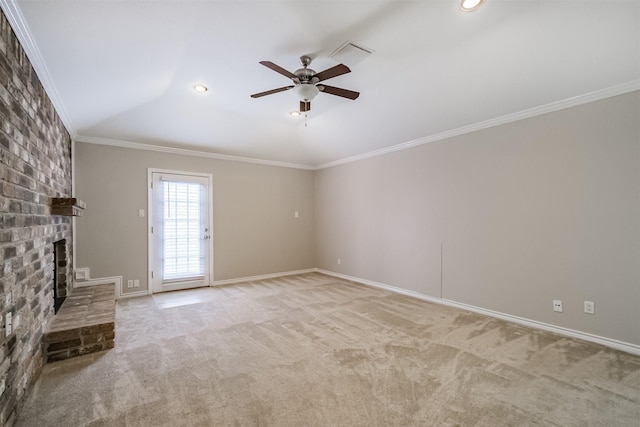 unfurnished living room featuring crown molding, ceiling fan, a brick fireplace, carpet, and baseboards