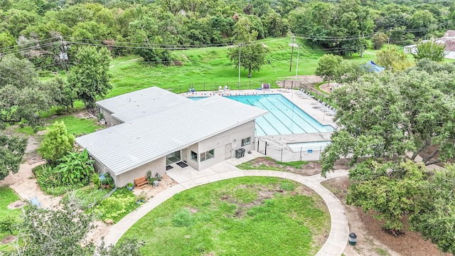 drone / aerial view with a wooded view