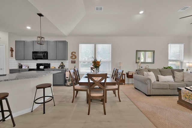 dining area with recessed lighting, visible vents, and a healthy amount of sunlight